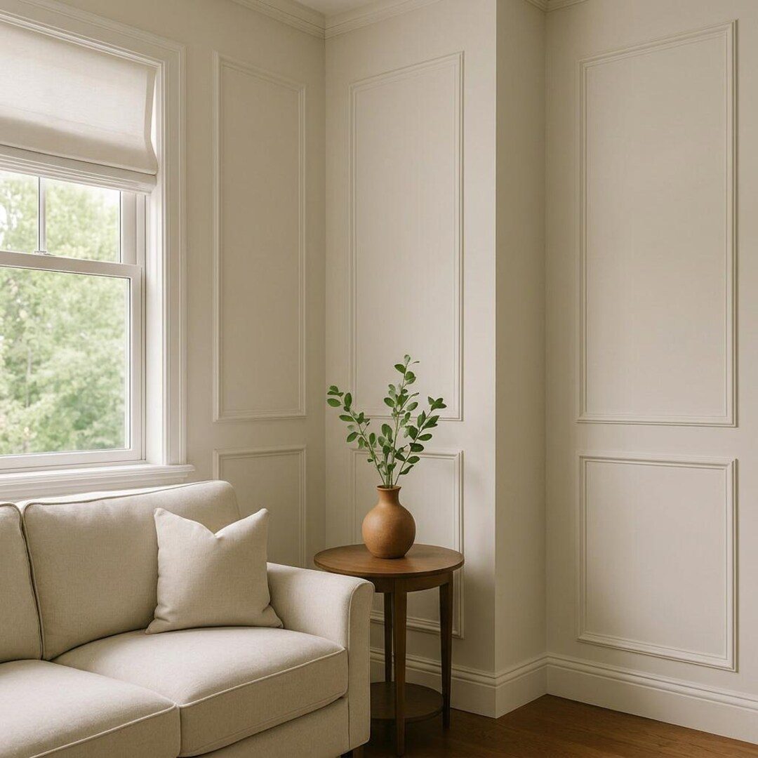 Picture frame moulding wrapping a corner and stopping on a window casing