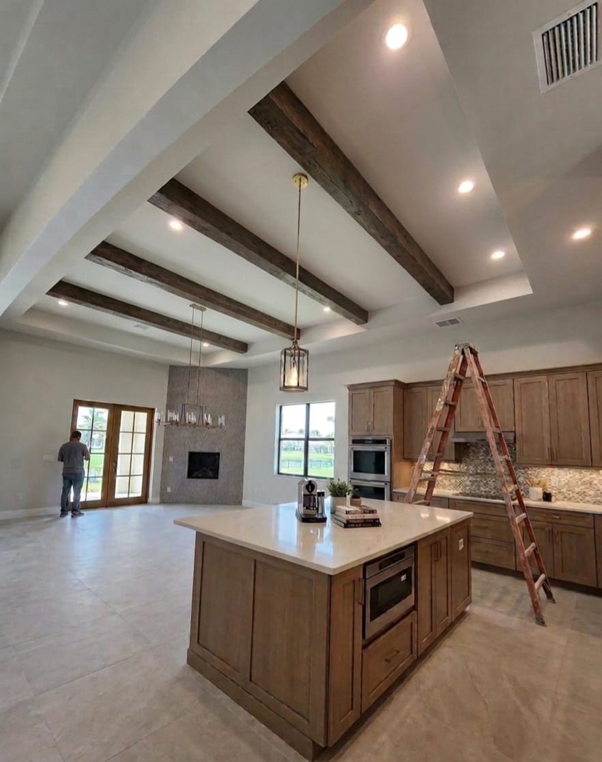 The same ceiling after faux wood beams were installed, near Windermere FL